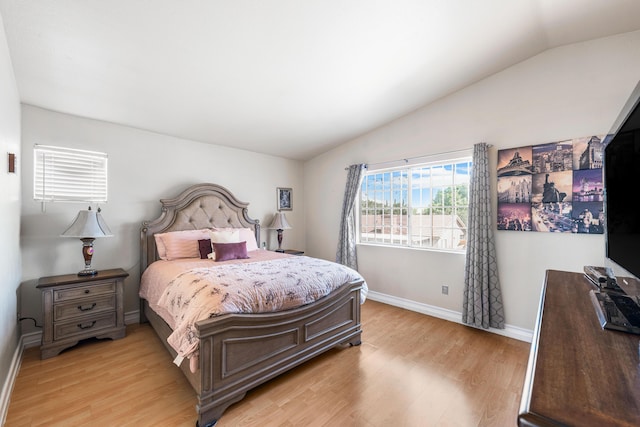 2321 Mulberry Ave, Lancaster, CA 93535 - bedroom with vaulted ceiling, light wood-style floors, and baseboards