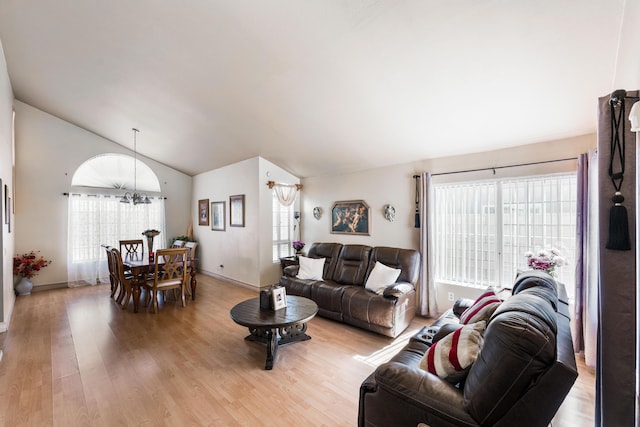 2321 Mulberry Ave, Lancaster, CA 93535 - living room with lofted ceiling, healthy amount of natural light, light wood-style flooring, and baseboards