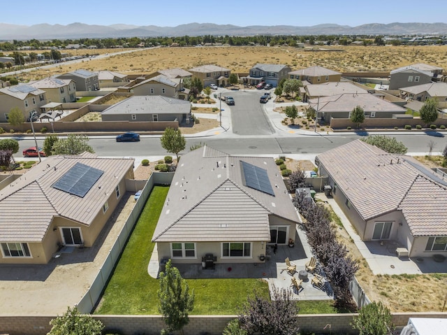 birds eye view of property with a mountain view