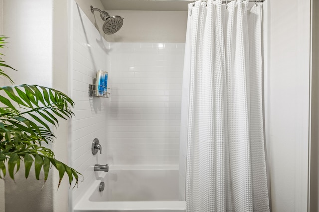 bathroom with shower / bath combo