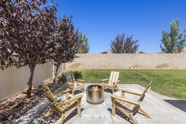 view of patio / terrace featuring an outdoor fire pit