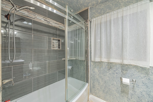 full bathroom featuring shower / bath combination with glass door