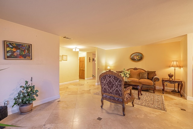 living room with visible vents and baseboards