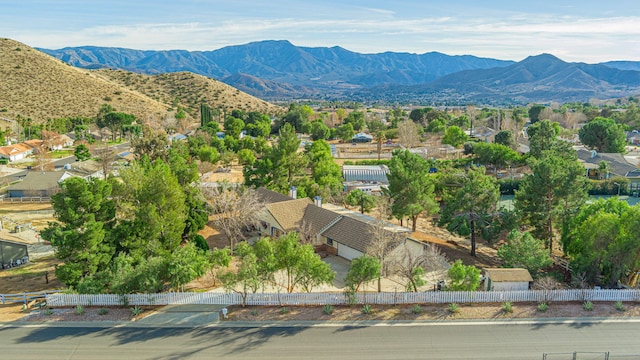 birds eye view of property featuring a mountain view