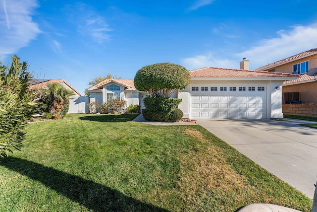 view of front of house featuring a garage and a front lawn