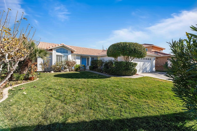 view of front of house with a garage and a front lawn