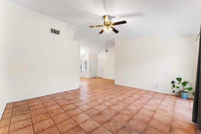 empty room featuring high vaulted ceiling and ceiling fan