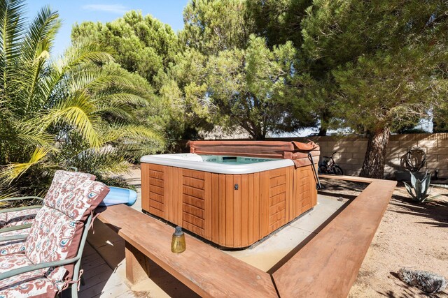 view of patio featuring a hot tub and a wooden deck