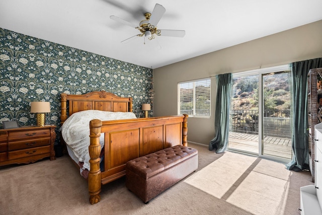 bedroom with access to exterior, light carpet, and ceiling fan