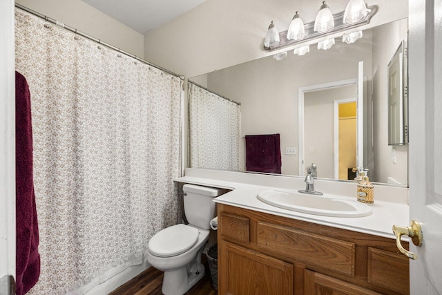 bathroom featuring hardwood / wood-style flooring, vanity, and toilet