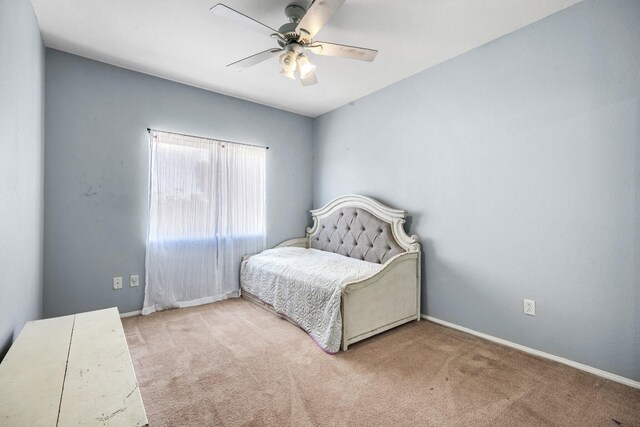 carpeted bedroom with ceiling fan