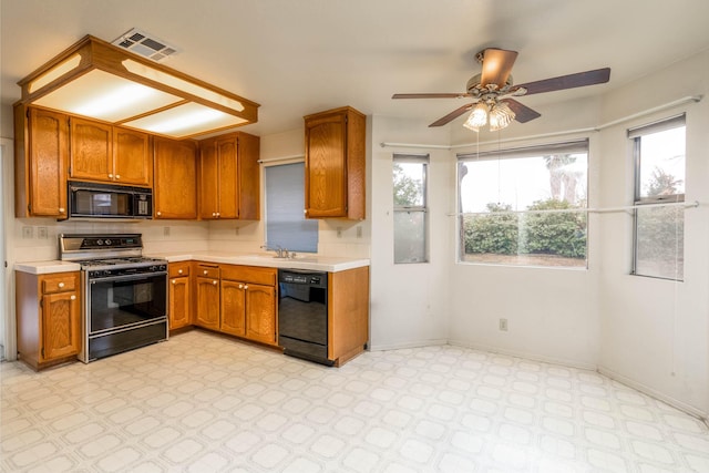 kitchen with sink, backsplash, ceiling fan, and black appliances