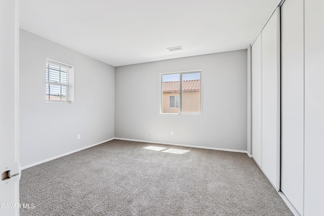4614 Stillmeadow Ln, Lancaster, CA 93536 - unfurnished bedroom featuring multiple windows, carpet, and baseboards