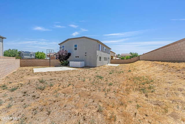4614 Stillmeadow Ln, Lancaster, CA 93536 - rear view of house featuring a fenced backyard, stucco siding, and a patio
