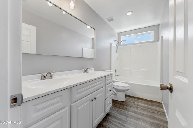 4614 Stillmeadow Ln, Lancaster, CA 93536 - bathroom featuring double vanity, toilet, washtub / shower combination, and wood finished floors