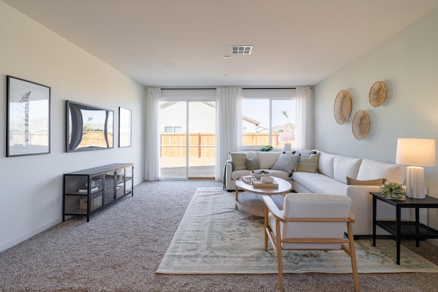 carpeted living room featuring visible vents