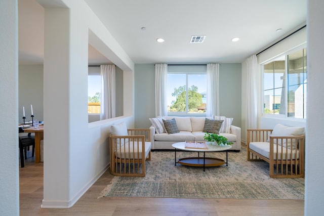 sitting room featuring visible vents, recessed lighting, baseboards, and wood finished floors