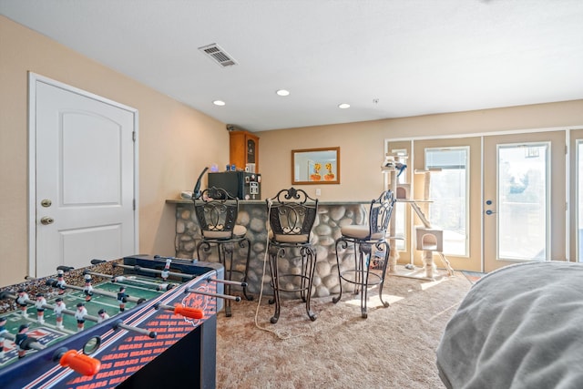 playroom featuring recessed lighting, carpet floors, visible vents, french doors, and a dry bar