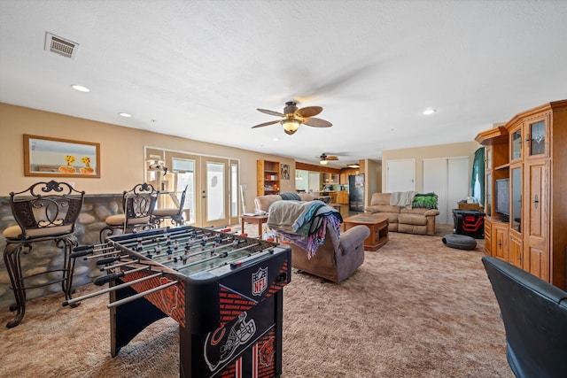 playroom with carpet floors, recessed lighting, visible vents, and french doors