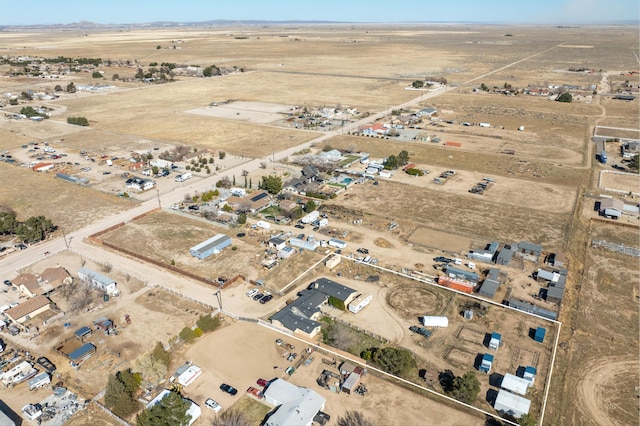 aerial view featuring view of desert and a rural view