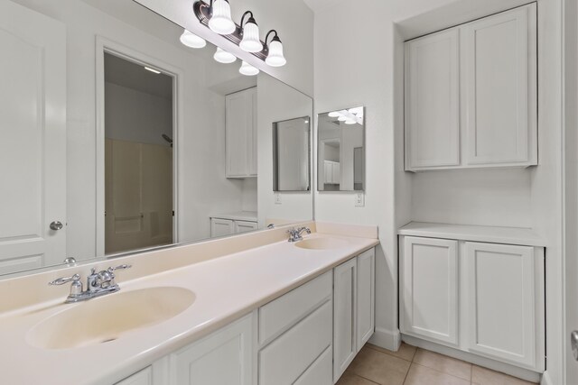 44838 Lotus Ct, Lancaster, CA 93536 - full bathroom with tile patterned flooring, double vanity, and a sink