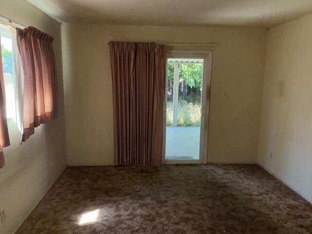 19 E 21st St, Tracy, CA 95376 - unfurnished room featuring healthy amount of natural light and carpet flooring