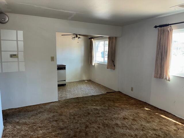 19 E 21st St, Tracy, CA 95376 - carpeted empty room with plenty of natural light