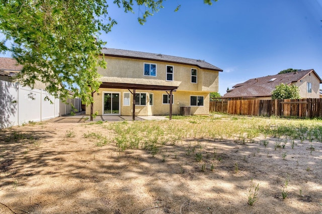 1236 Marion Ave, Lancaster, CA 93535 - rear view of property with stucco siding, a fenced backyard, a patio, and central AC unit