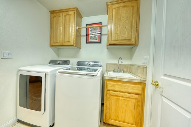 laundry room with cabinet space and washing machine and dryer