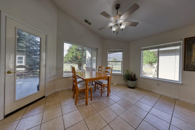 dining area with vaulted ceiling, baseboards, light tile patterned floors, and ceiling fan