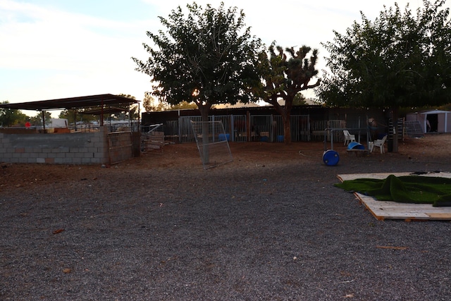 view of yard at dusk