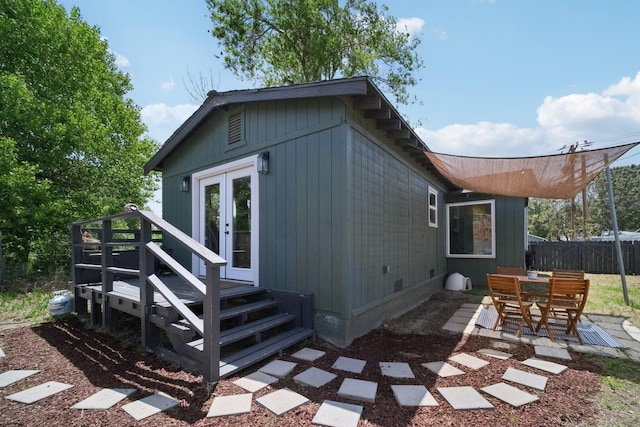 18133 Ellstree Dr, Lake Hughes, CA 93532 - back of property featuring french doors, fence, a deck, and crawl space