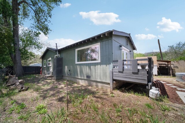 18133 Ellstree Dr, Lake Hughes, CA 93532 - view of side of property with a deck and fence