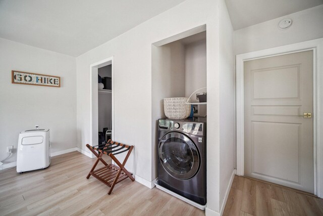 18133 Ellstree Dr, Lake Hughes, CA 93532 - washroom featuring washer / clothes dryer, light wood finished floors, and baseboards