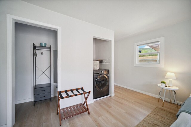 18133 Ellstree Dr, Lake Hughes, CA 93532 - living area featuring washer / clothes dryer, wood finished floors, and baseboards