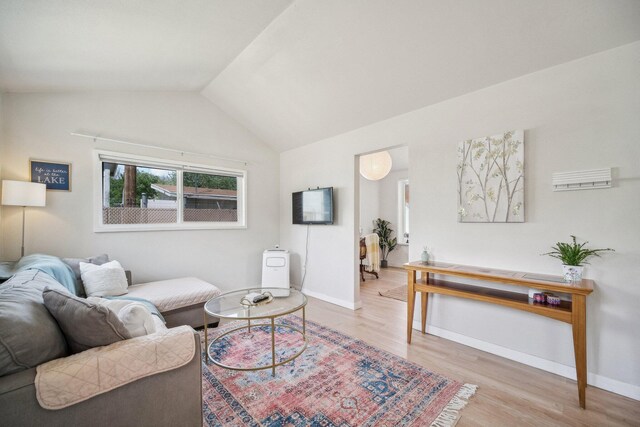18133 Ellstree Dr, Lake Hughes, CA 93532 - living room featuring wood finished floors, lofted ceiling, and baseboards