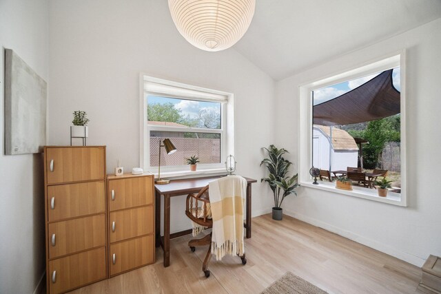 18133 Ellstree Dr, Lake Hughes, CA 93532 - office featuring plenty of natural light, light wood-style flooring, lofted ceiling, and baseboards