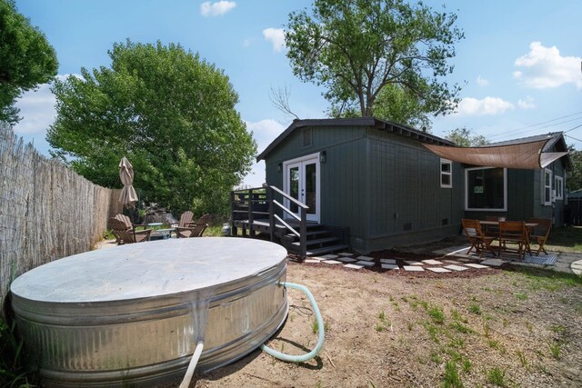 18133 Ellstree Dr, Lake Hughes, CA 93532 - back of property featuring a hot tub, fence, french doors, and a patio