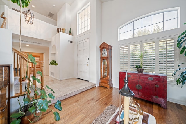 foyer featuring a high ceiling and wood-type flooring