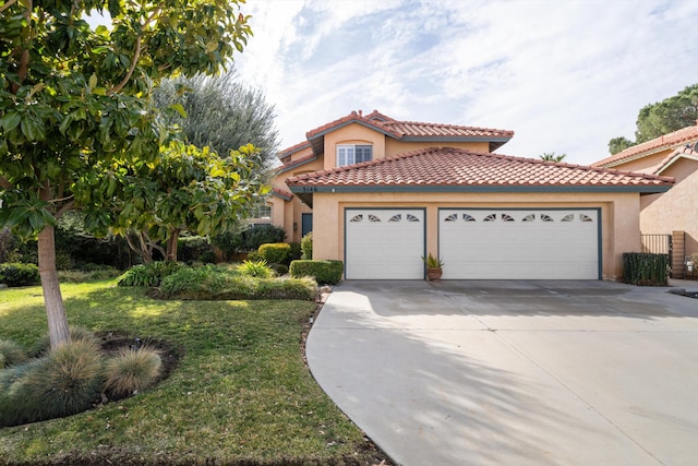 mediterranean / spanish home with a garage and a front lawn