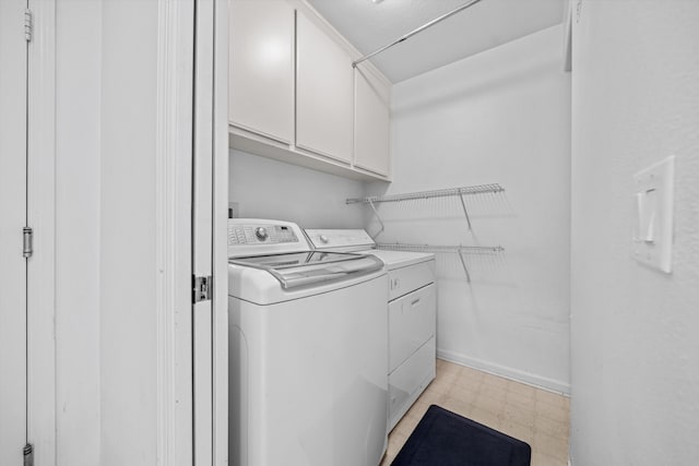 washroom with cabinets and independent washer and dryer