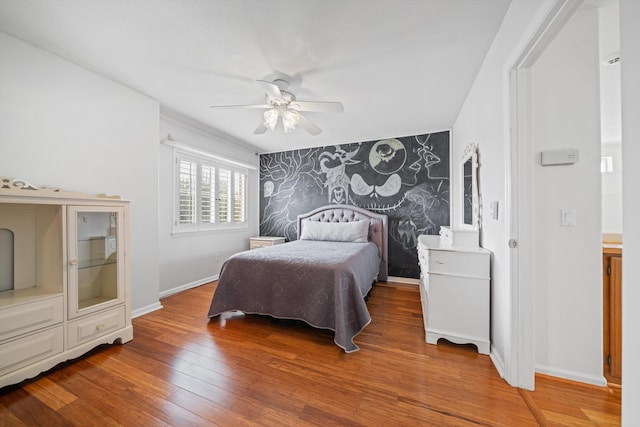 bedroom featuring wood-type flooring and ceiling fan