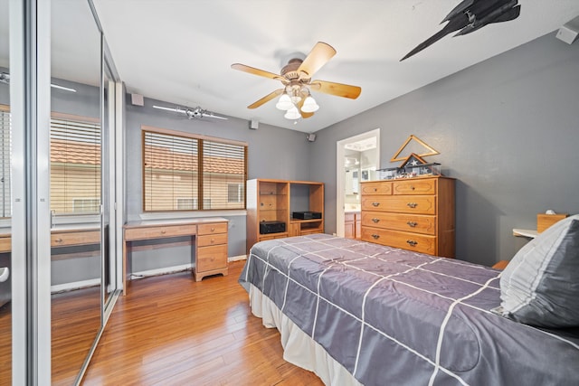 bedroom with ceiling fan and light hardwood / wood-style flooring