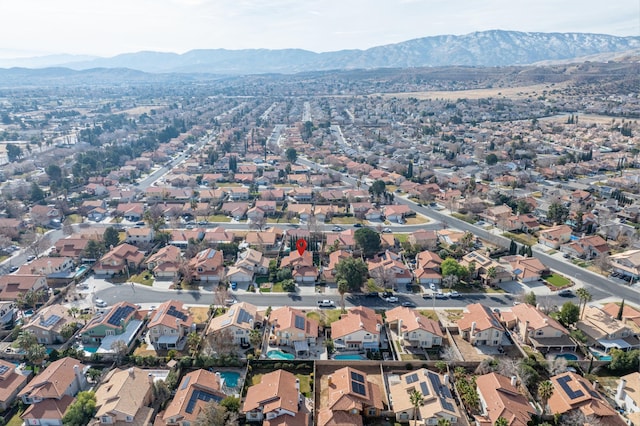 birds eye view of property with a mountain view