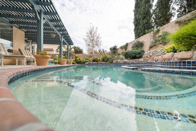 view of swimming pool with a pergola