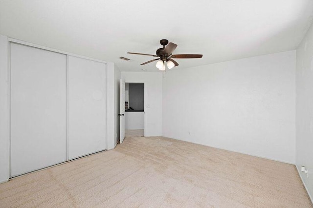 2133 Knollwood Ct, Rosamond, CA 93560 - unfurnished bedroom with carpet floors, ceiling fan, visible vents, and a closet