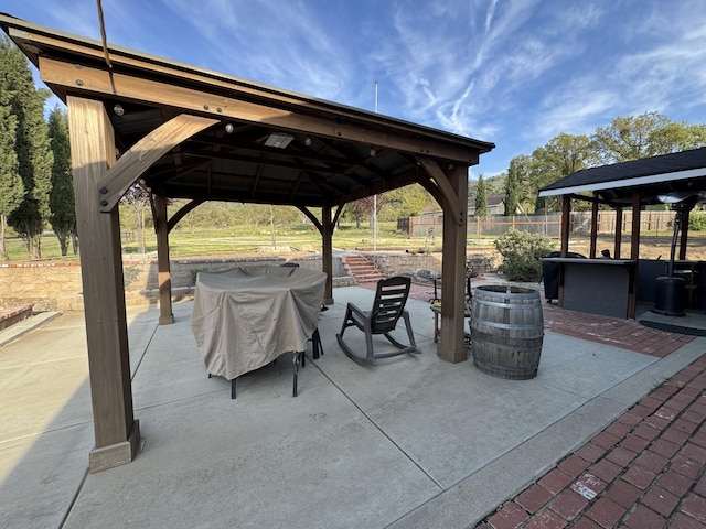 view of patio / terrace with a gazebo and fence