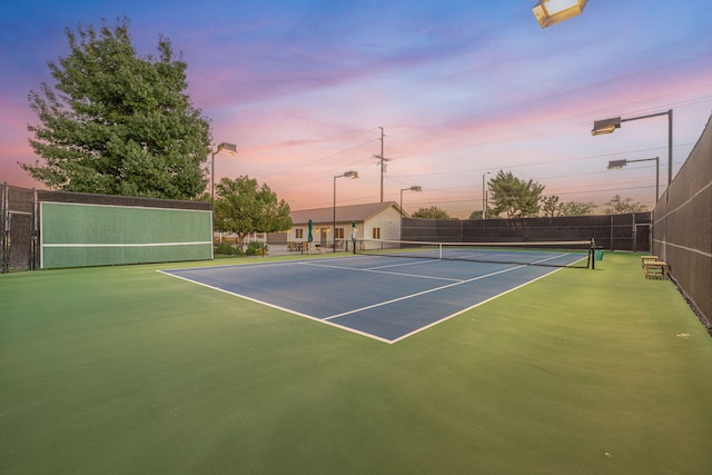 view of sport court with basketball hoop