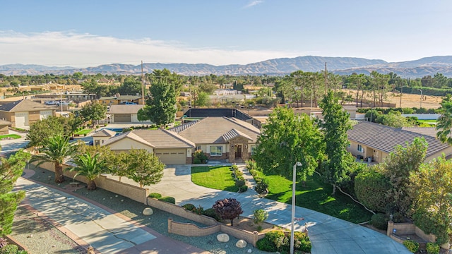 birds eye view of property featuring a mountain view