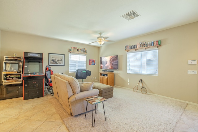 tiled living room featuring ceiling fan